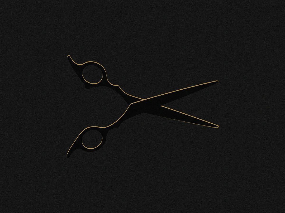Barber's shears in silhouette, edges caught by a thin line of gold light.